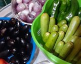A picture of step 4 of Iraqi Dolma 🥒🫑🍆🥔🍅🧅.
