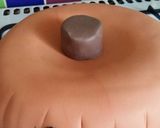 A picture of step 14 of Vickys Halloween Pumpkin Piñata Cake, Decorating Idea.