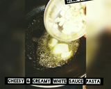 A picture of step 1 of Cheesy & creamy white sauce pasta🍜.