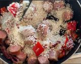 Foto del paso 6 de la receta Arroz con butifarra y puntas de jamón