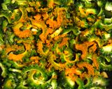A picture of step 2 of Uchche Bhaja (Bitter Gourd Fry).