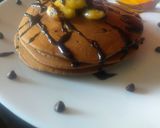 A picture of step 5 of Choco pancake topped with caramelized banana.