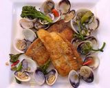 A picture of step 8 of Pan fried sea bream with sake braised clams and broccolini.