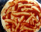 A picture of step 2 of My little Alfrado Pizza with 2 Cheese & Tomato 😘.