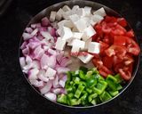 A picture of step 1 of Paneer, Onion and Capsicum sabzi.