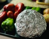A picture of step 1 of Cauliflower Escalivada 🫑 🧅 🍅 🥦.