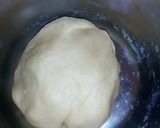 A picture of step 7 of Bow tie buns.