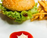 A picture of step 5 of Chicken shami burger with crunchy fries 😋👌.