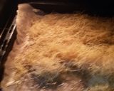 A picture of step 2 of Kunafa and Qashtalia Decorated with Oranges, Strawberries, and Bananas.