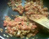 A picture of step 10 of Baigan ka bharta with peas.