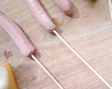 A picture of step 2 of Stick egg net sausage.