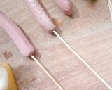 A picture of step 2 of Stick egg net sausage.