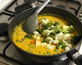 A picture of step 6 of Mix veg with mango purée and coconut milk.