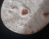 A picture of step 3 of Tortilla cheese roll.