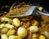 A picture of step 3 of Masala baby corn curry.