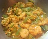 A picture of step 7 of Jal Bhara Chichinga / Steamed fritters in Snake Gourd curry.