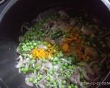 A picture of step 1 of Mattar masala rice.