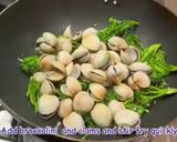 A picture of step 5 of Pan fried sea bream with sake braised clams and broccolini.