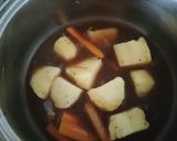 Foto del paso 7 de la receta: Cinta de Lomo con Naranja, Salsa de Humo y Hoisin al Papillote con sus Patatas y Zanahorias