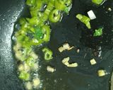 A picture of step 3 of Healthy Makhaana Salad with fruits veggies and nuts.