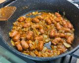 A picture of step 8 of Mini Pork Sausages with Red Pesto, Garlic, Onion, and Oregano.