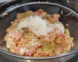 A picture of step 3 of Bring-a-smile chicken burgers with blue cheese or pesto filling 😊.