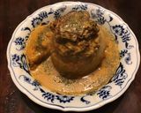 A picture of step 4 of California Farm Stuffed Baked Onions.