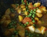 A picture of step 11 of Peas Tomato Potato Curry.