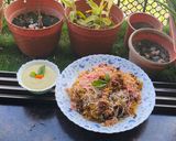 A picture of step 9 of Smokey tandoori chicken drumsticks biryani with mint mango raita.