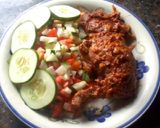 A picture of step 1 of Peppered chicken with cucumber and tomato salad.