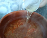 Foto del paso 3 de la receta: Arroz caldoso de rape y langostinos con crema de nécoras