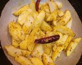 A picture of step 4 of Kumaoni Aloo Gutke with pooris.