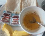 A picture of step 2 of Nutella banana Swiss rolls.