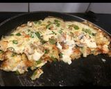 A picture of step 4 of Veg Omelette stuffed with veg mayonnaise.