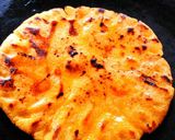 A picture of step 14 of Sarso ka saag with makki roti.