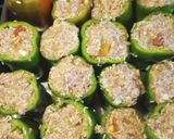 A picture of step 2 of Stuffed Bell Peppers in a Red Sauce.