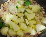A picture of step 3 of Batata Kanda Poha.