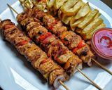 A picture of step 9 of Juicy chicken skewers/mshikakis.