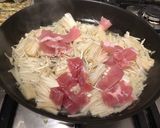 A picture of step 2 of Pan fry enokitake with bacon 🥓.
