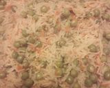 A picture of step 4 of Rice with Carrots and Peas.