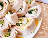 A picture of step 4 of Mini Ham and Cream Cheese Wraps.