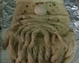 A picture of step 11 of Garlic Bread Santa.