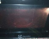 A picture of step 7 of Italian pizza bread.