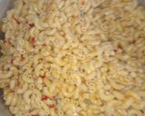 A picture of step 5 of Jollof macaroni with fried boneless fish.