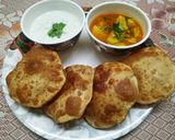 A picture of step 8 of Ajwain ki Poori with Aloo Tamatar Sabzi.