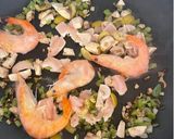 A picture of step 3 of Delicious Mixed Paella with Chicken, Shrimp, and Mushrooms.