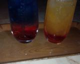 A picture of step 2 of Sunrise mocktail nd Blue layered paradise.
