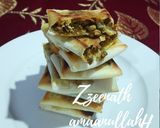 A picture of step 4 of Arabic Mutabbaq with Spring Rolls.