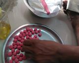 A picture of step 5 of Hibiscus Thai rice balls dunk in coconut milk.