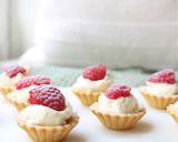 A picture of step 4 of Lemon Curd Cream filled tart cases with store bought pastry cases.